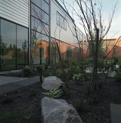 Rieke Science Center reflected in the windows of Morken Center for Learning and Technology at Pacific Lutheran University